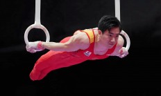 体操赛场上悬念重重，谁将夺得金牌